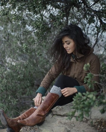Picture of Yasmine Al-Bustami in dark gray jacket with nature background